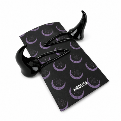 Black clips on patterned card