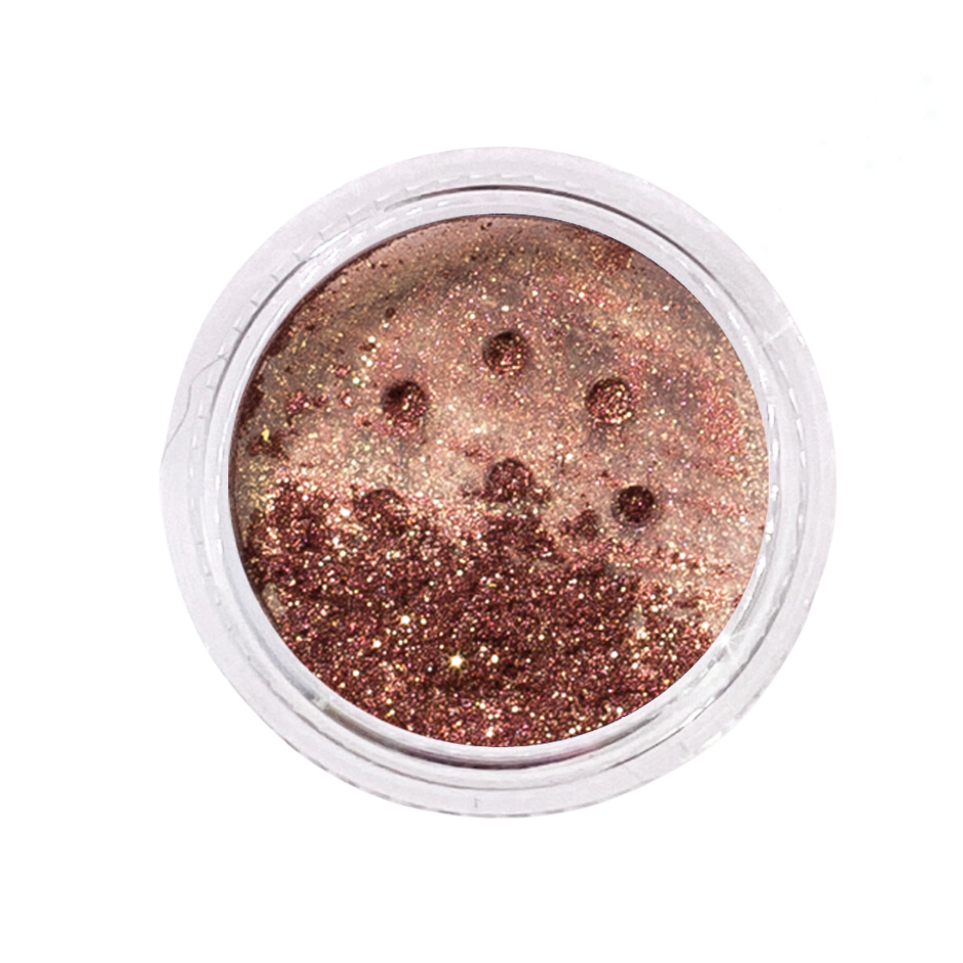 Metallic glitter in a small open container on a white background
