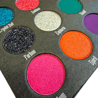Makeup eyeshadow palette with various colors and names on a white background