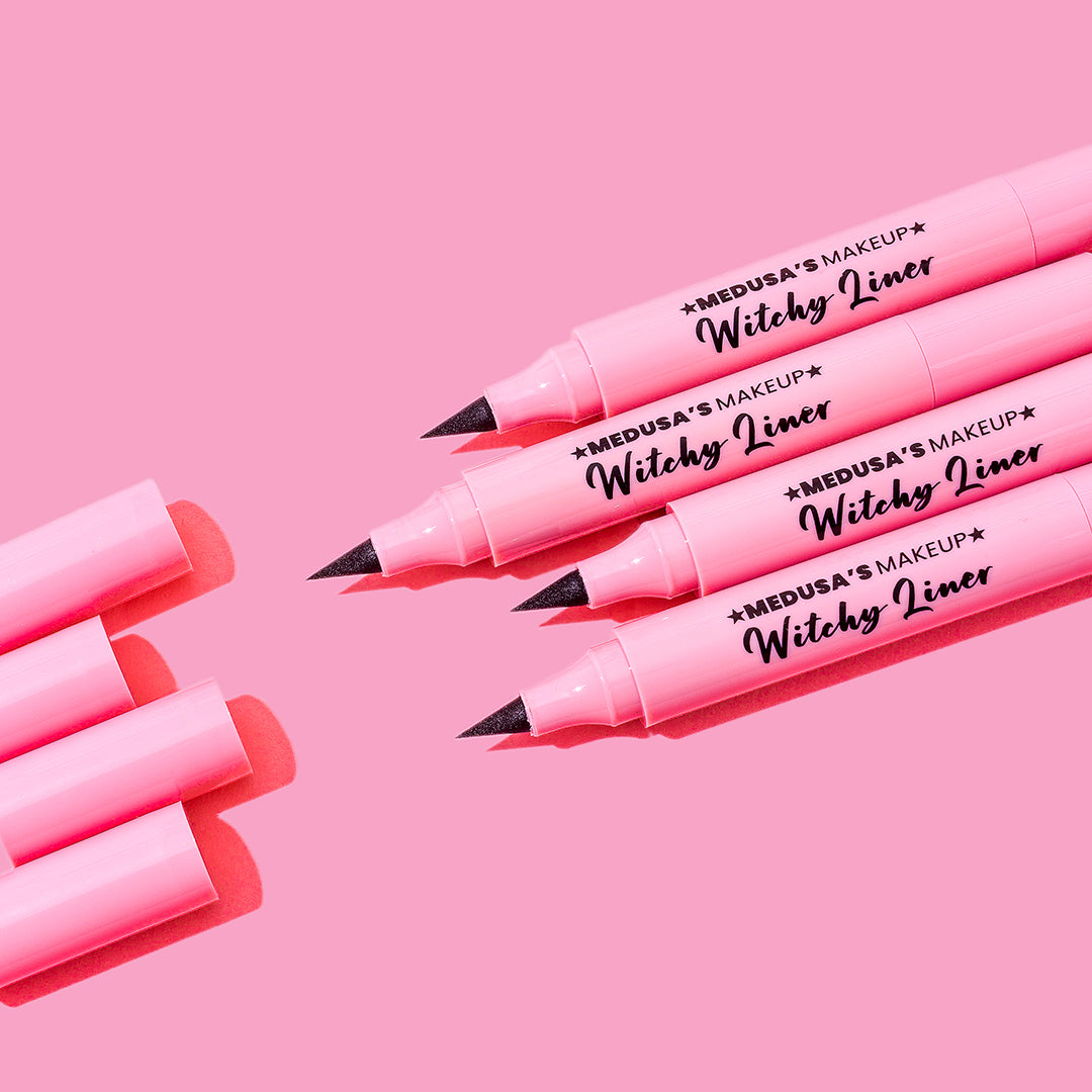 Witchy liner eyeliner wing stamp pen on pink background