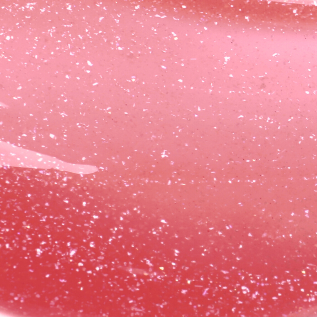 Close-up of a pink surface with glittery specks