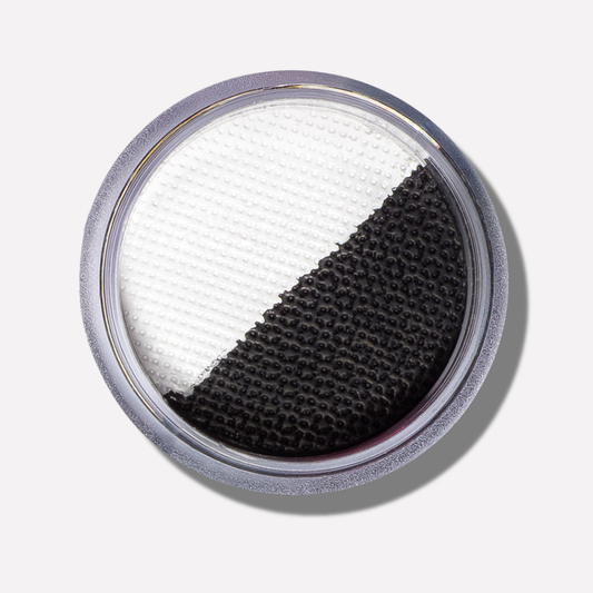 Round filter with white and black sections on a light gray background