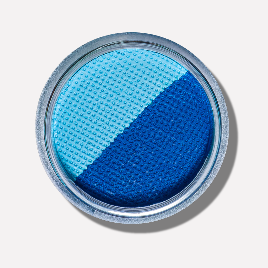 Blue makeup compact with two shades on a light gray background