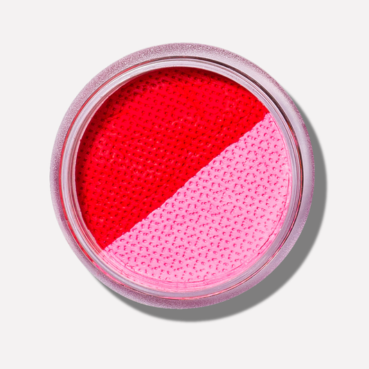 Makeup compact with red and pink shades on a white background