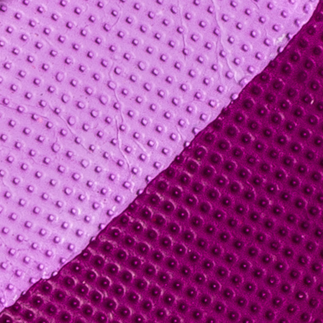 Close-up of purple textured material with a gradient effect