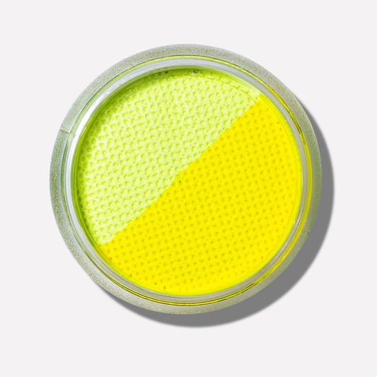 Yellow makeup compact on a white background