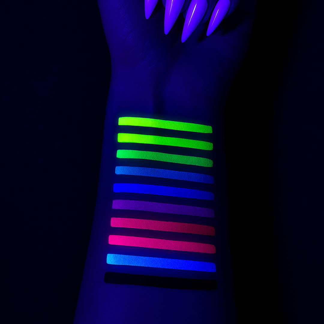 Glow sticks in various colors on a wrist against a dark background