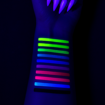 Glow sticks in various colors on a wrist against a dark background
