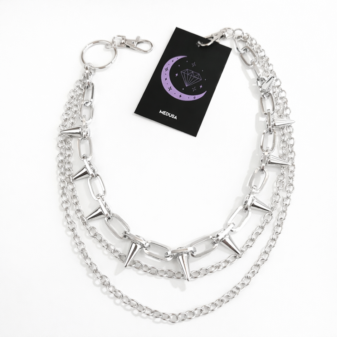 Silver chain necklace with a black card displaying 'MEDUSA' on a white background