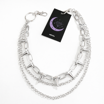 Silver chain necklace with a black card displaying 'MEDUSA' on a white background