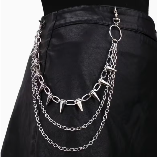 Black leather skirt with silver chain and spike accessory on a white background