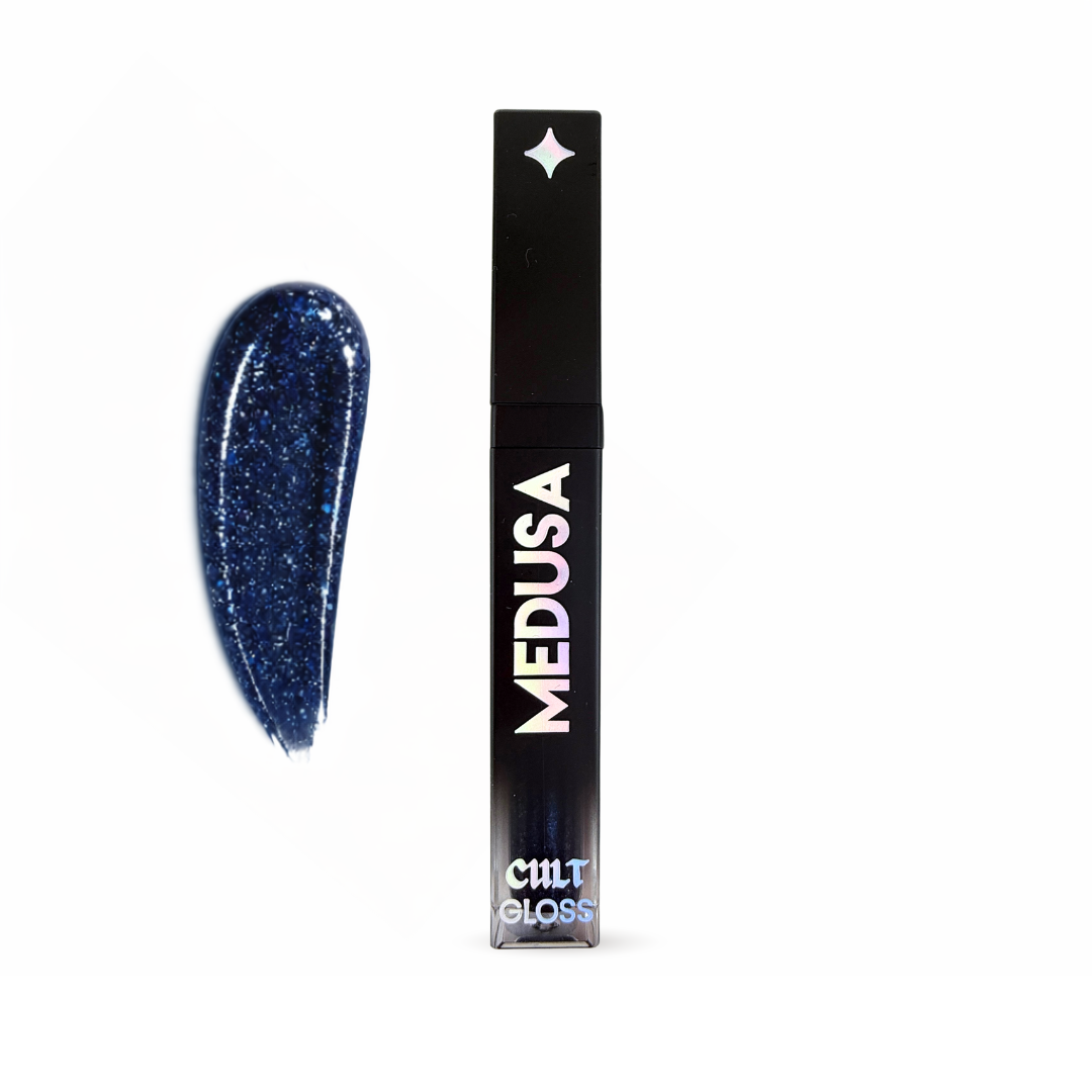 Blue glittery lip gloss with black packaging labeled 'MEDUSA' on a white background