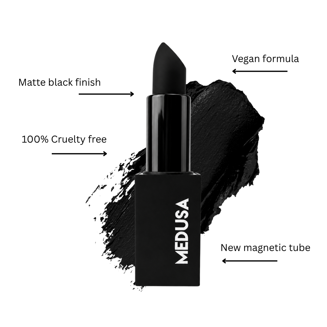 Black lipstick tube with matte black bullet, shown on a white background with a black makeup smear behind it and callout text reading 'Matte black finish,' 'Vegan formula,' '100% Cruelty free,' and 'New magnetic tube.' The brand name MEDUSA is visible on the tube.