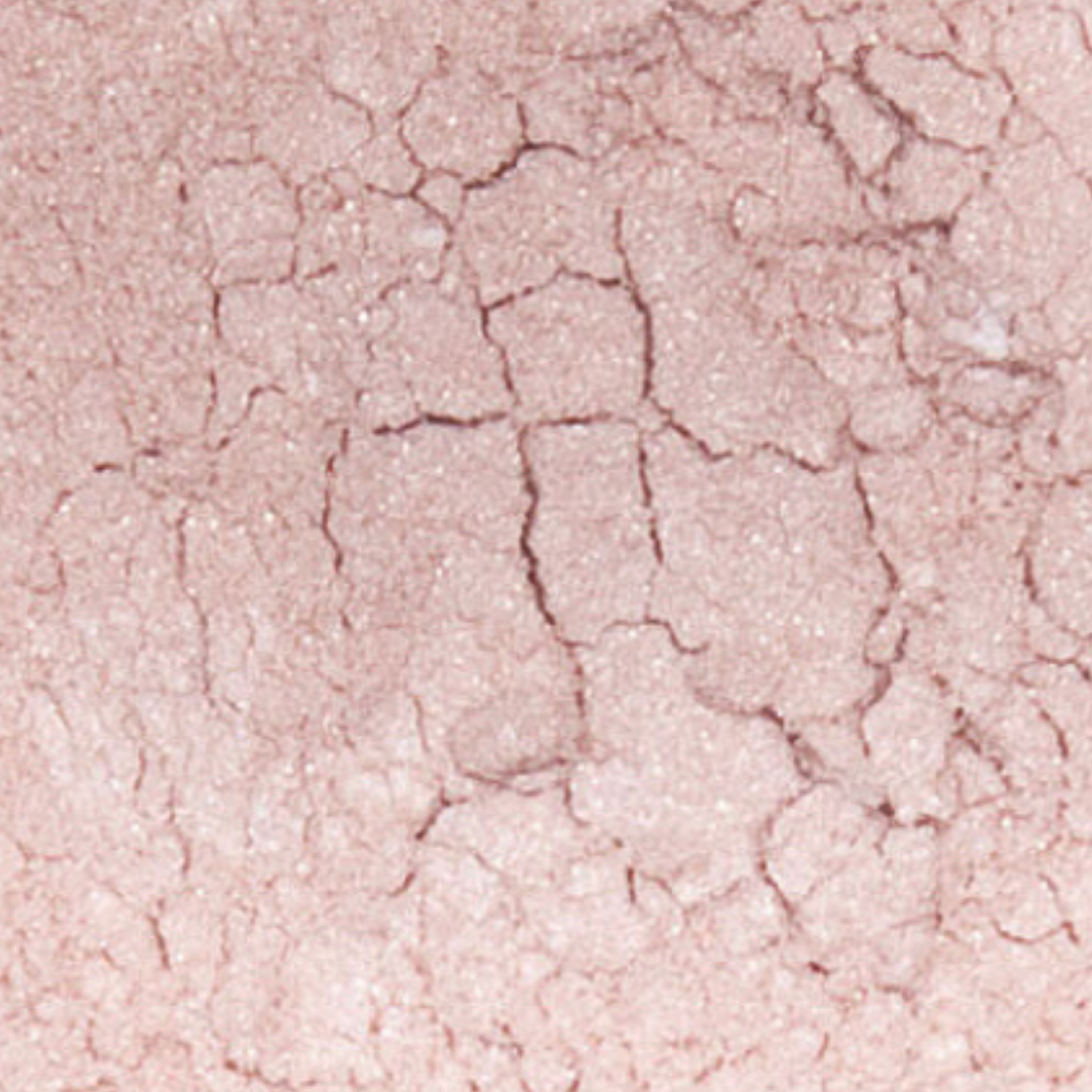 Close-up of a pink textured surface with cracks