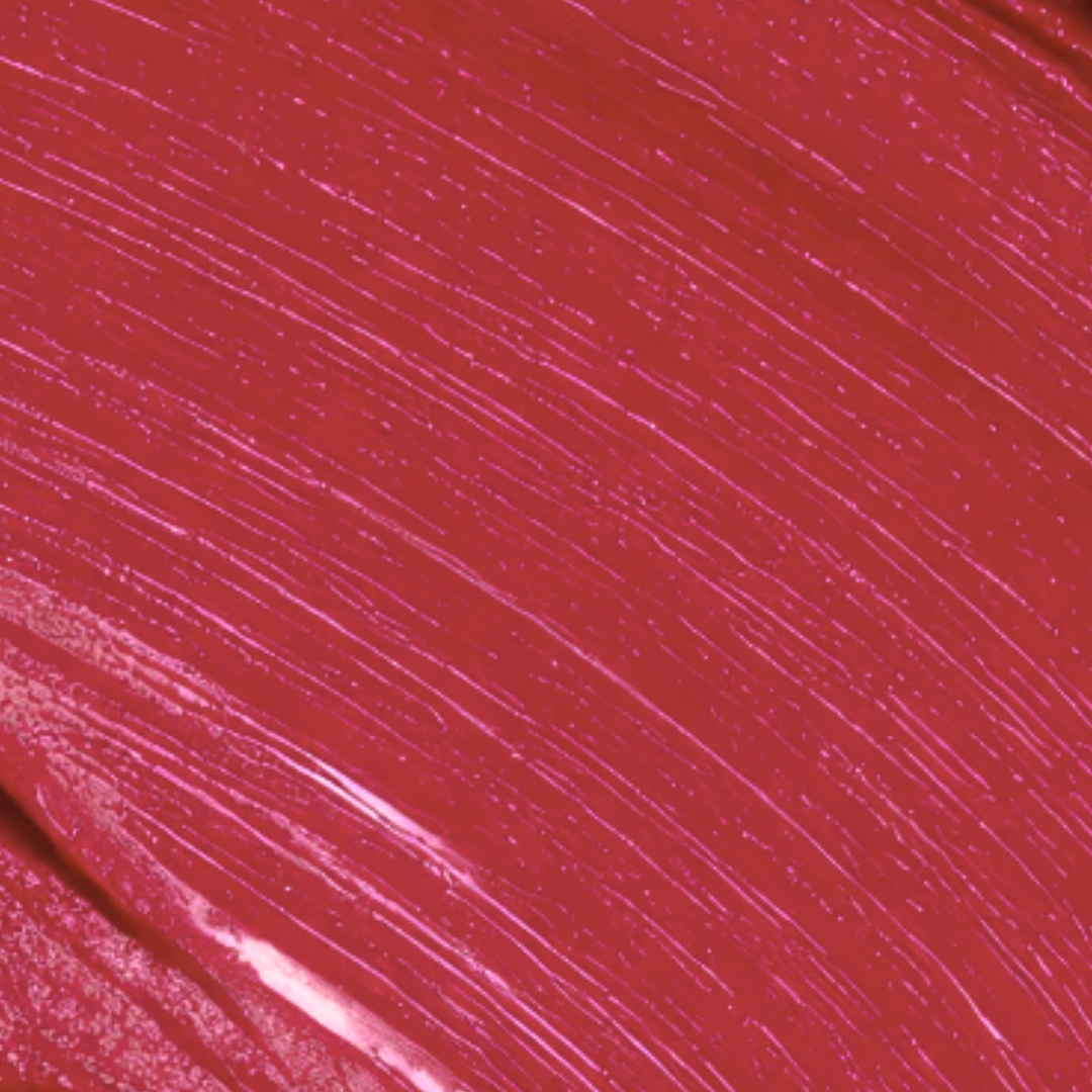Close-up of a smooth, glossy red lipstick texture