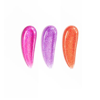 Three glittery nail polishes in pink, purple, and orange on a white background