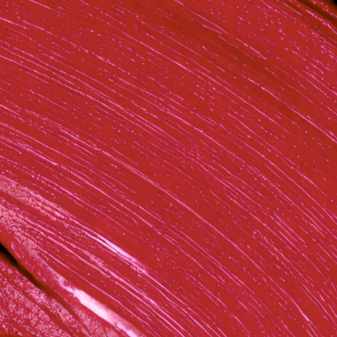 Close-up of a smooth, glossy red lipstick texture