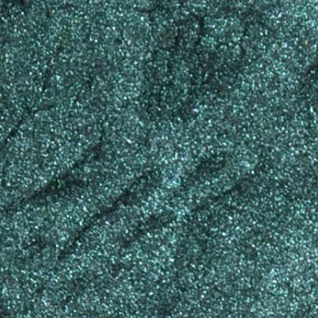 Close-up of dark green glittery powder