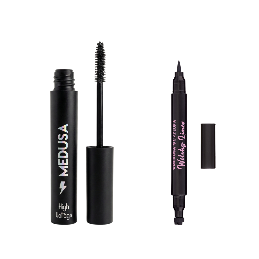 Set of black makeup products including mascara, eyeliner, and eyelash curler on a white background.