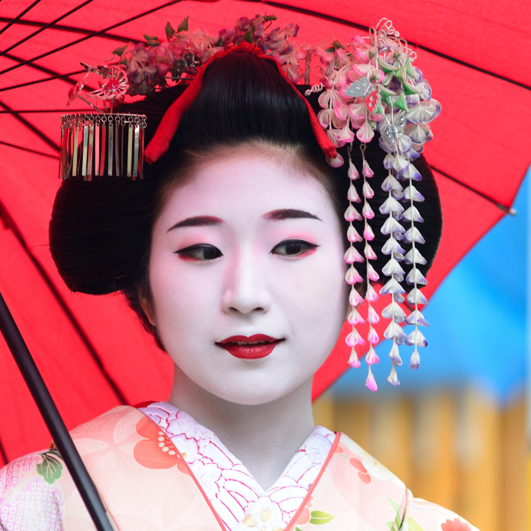 Geisha wearing period makeup and costume
