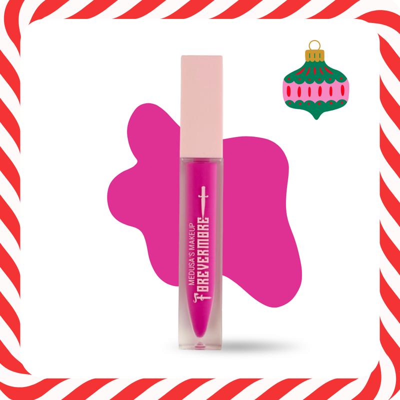 Pink makeup product with a candy cane border and Christmas ornament