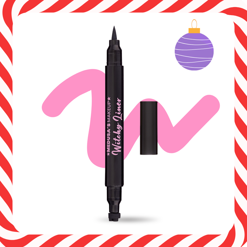 Black eyeliner pen with pink and purple makeup products on a candy cane-themed background