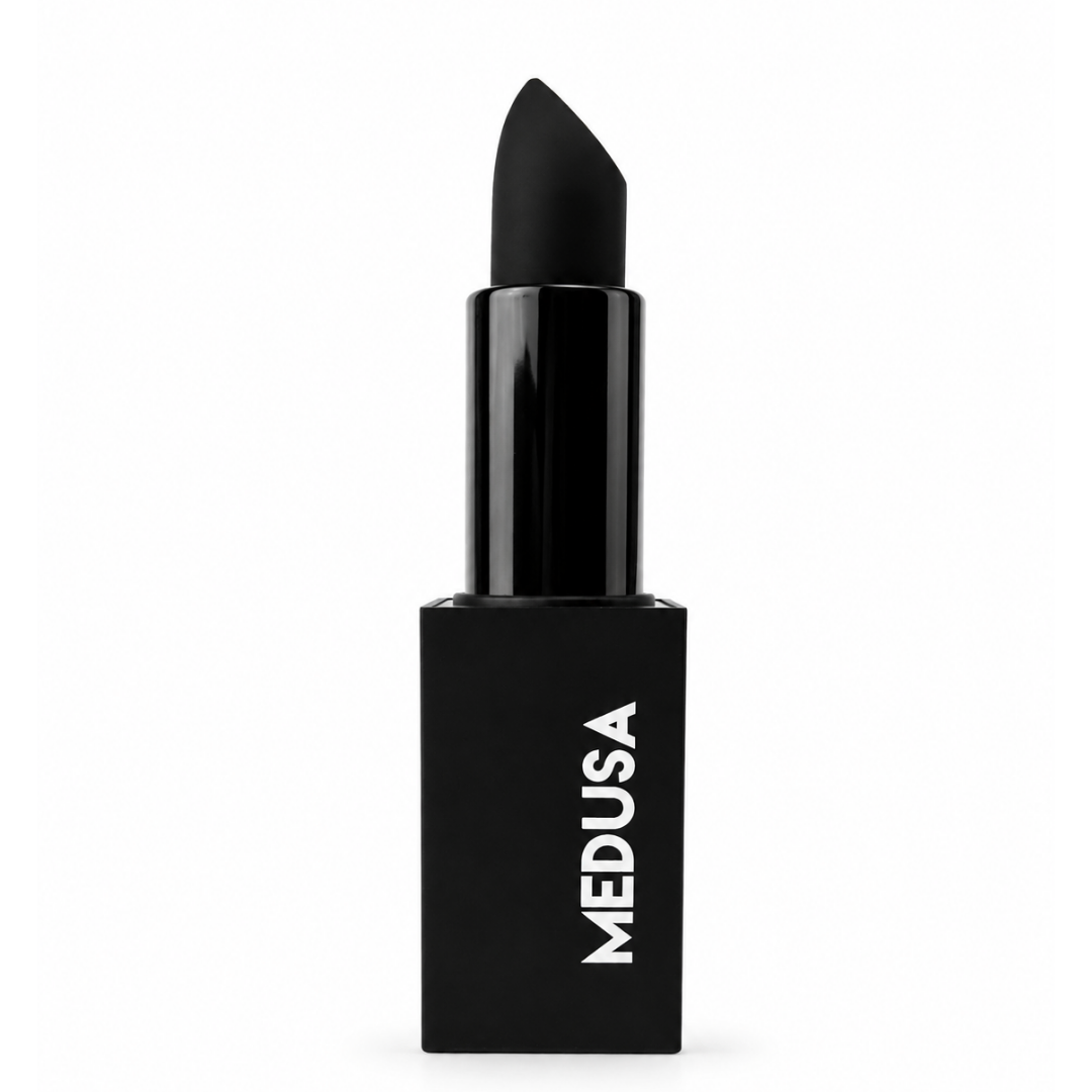 A black lipstick with a matte black bullet and a glossy black tube, featuring the brand name 'MEDUSA' printed vertically in white on the base, set against a plain white background.