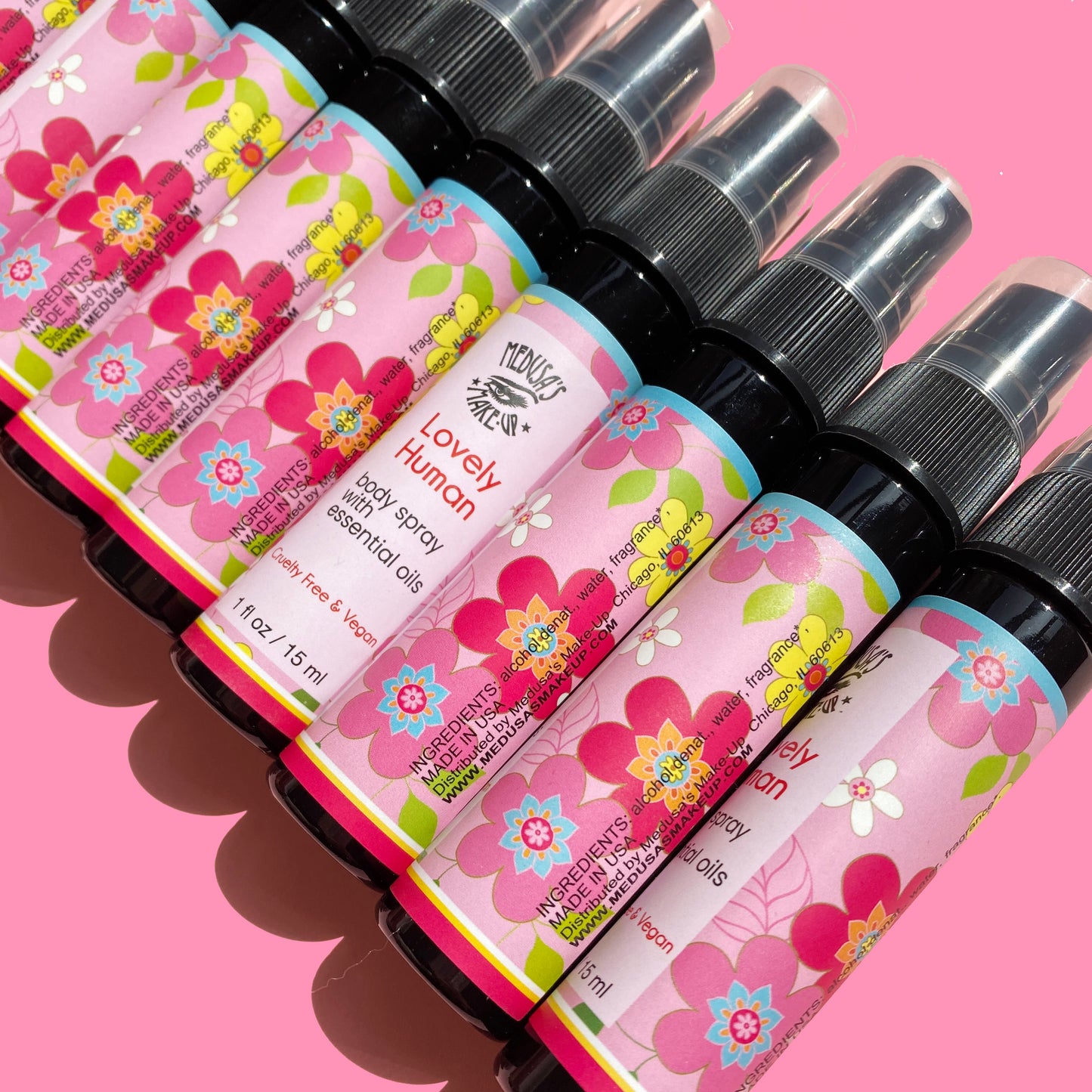 lovely human body spray bottles on pink background