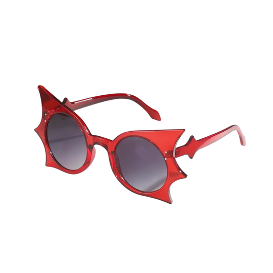 Red cat-eye sunglasses with dark lenses on a white background