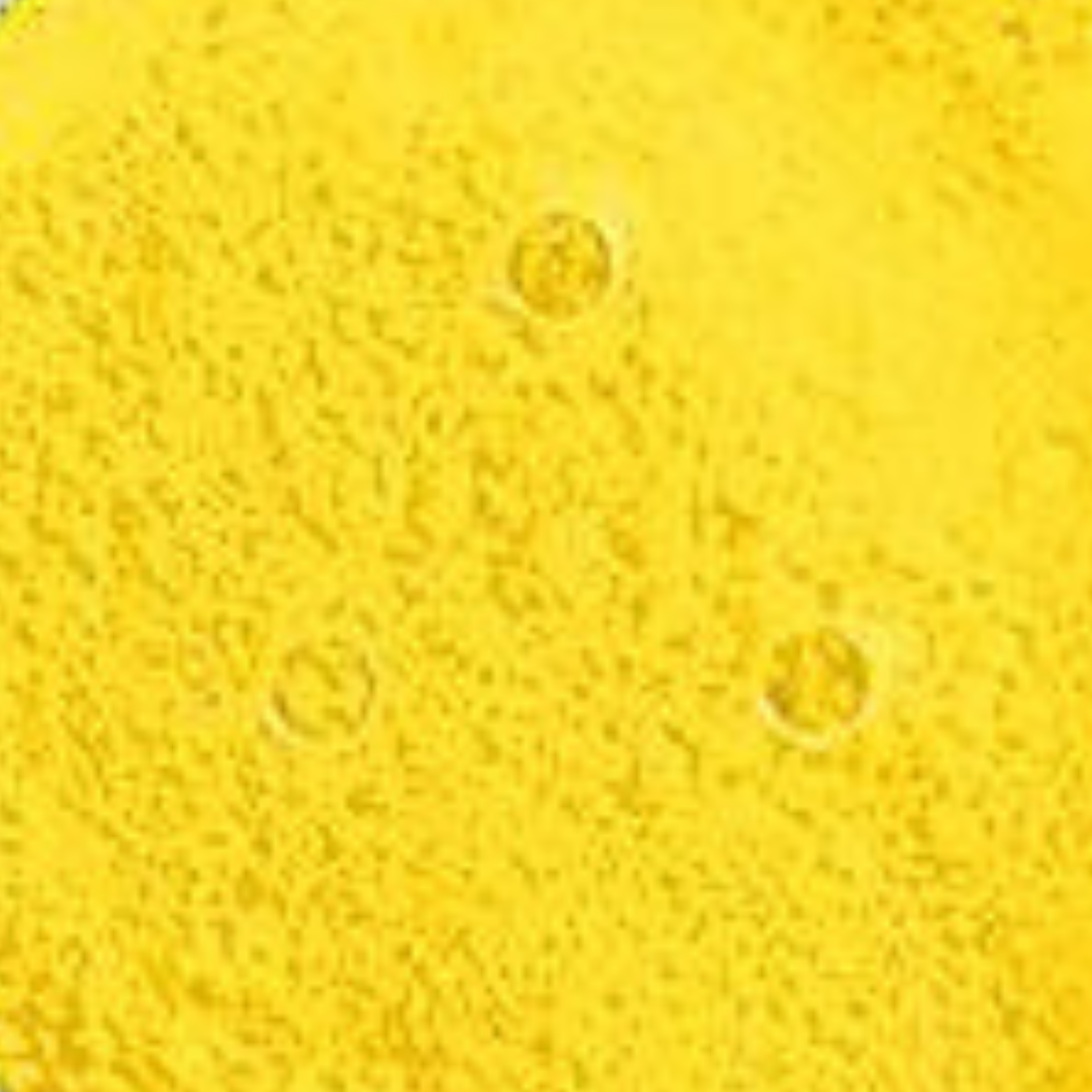 Close-up of a textured yellow surface with circular patterns