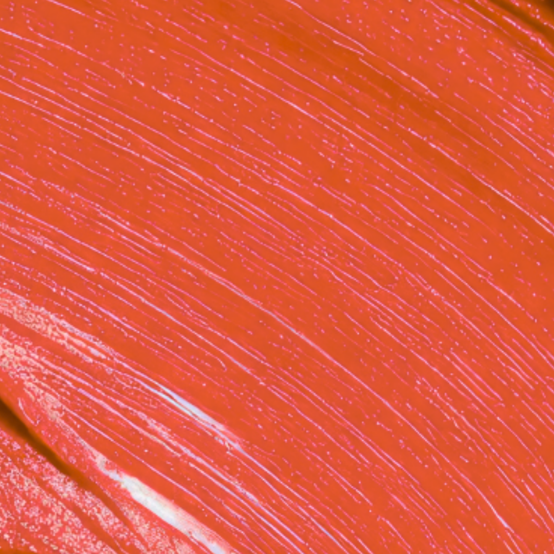 Close-up of a textured orange surface with white lines