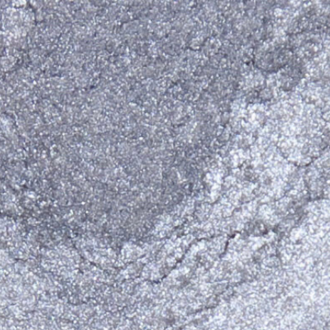 Close-up of grayish-brown sand with a textured surface