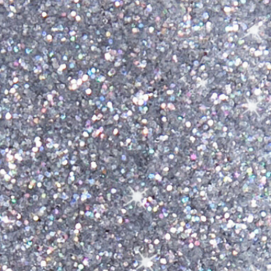 Close-up of silver glitter on a gray background