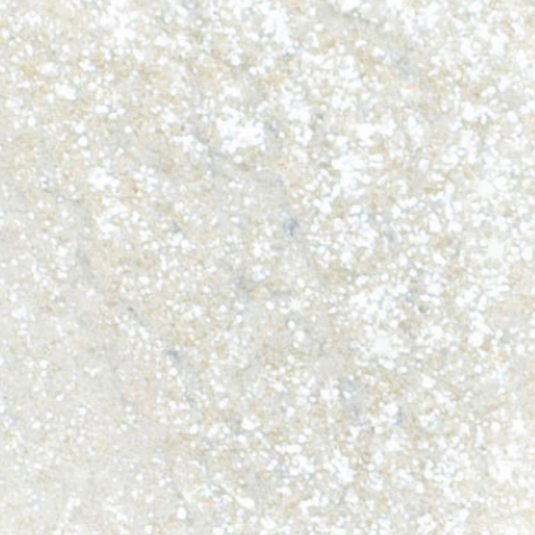 Close-up of a textured beige surface with small variations in color.