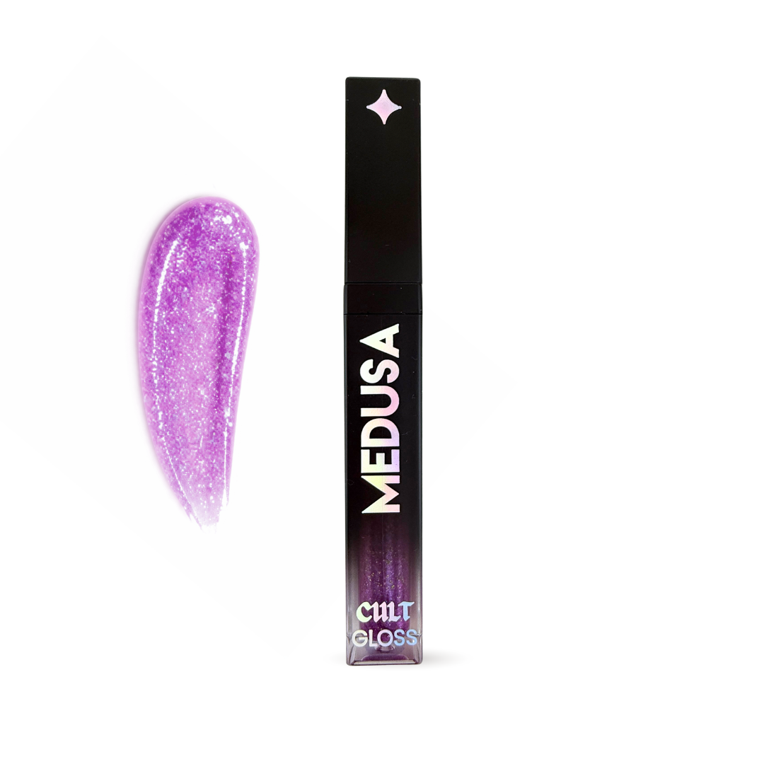 Purple glittery lip gloss with black packaging labeled 'MEDUSA' on a white background
