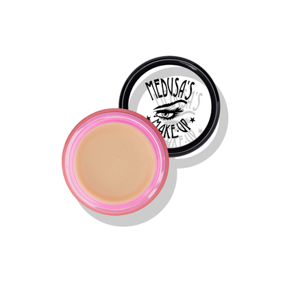 Makeup container with pink rim and beige cream, featuring 'Medusas Make-Up' logo.