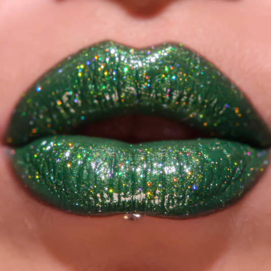 Close-up of green glittery lipstick on lips