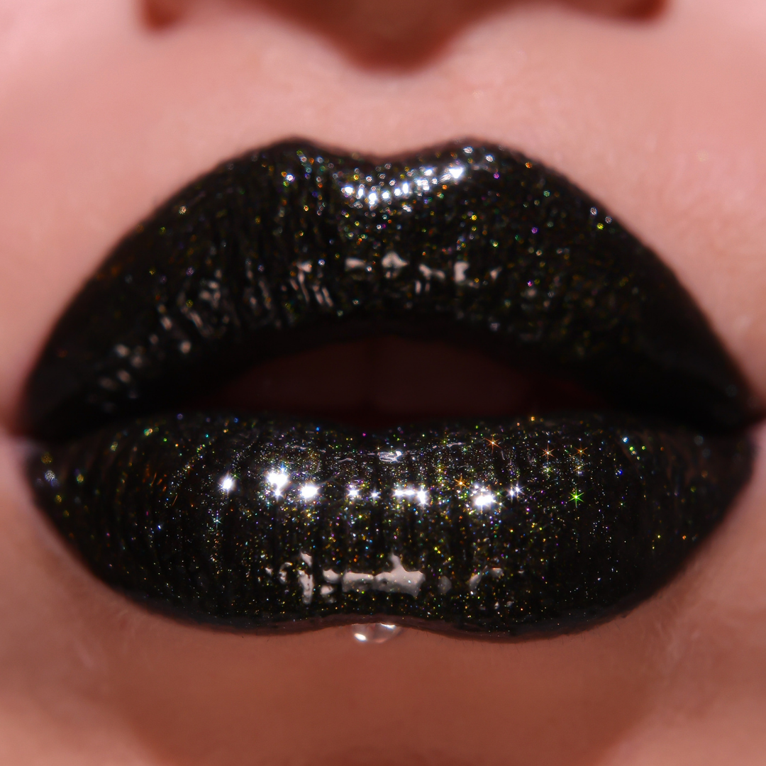 Close-up of lips with black glittery lipstick
