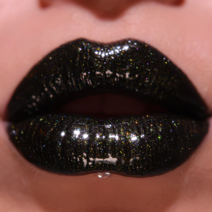 Close-up of lips with black glittery lipstick