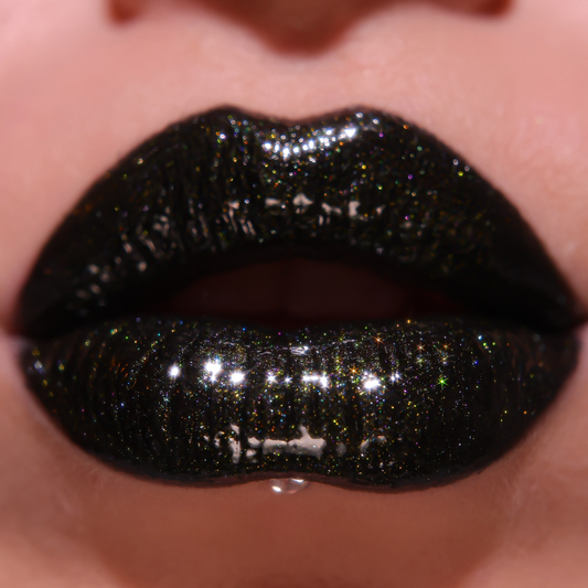 Close-up of lips with black glittery lipstick