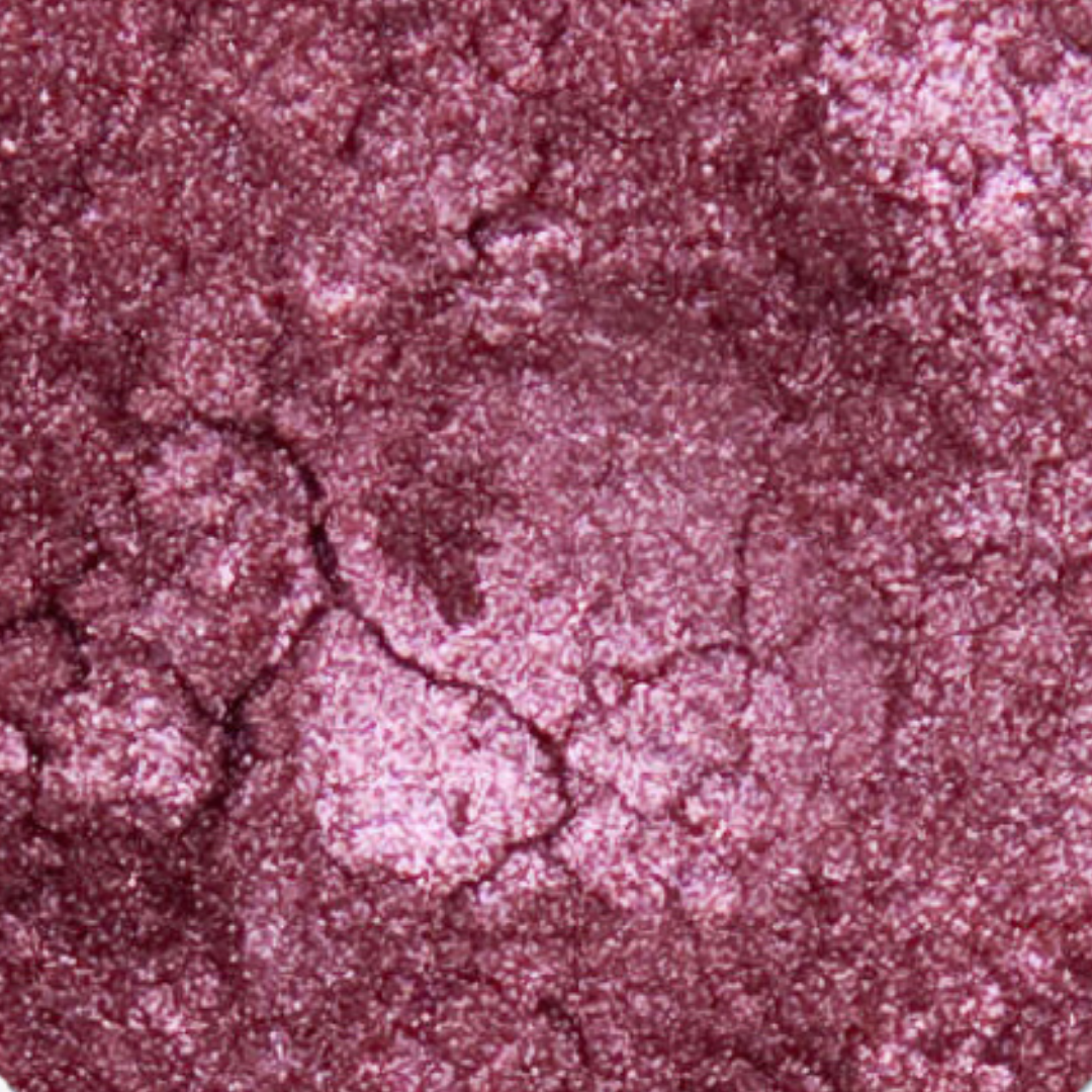 Close-up of a textured pinkish-purple color swatch