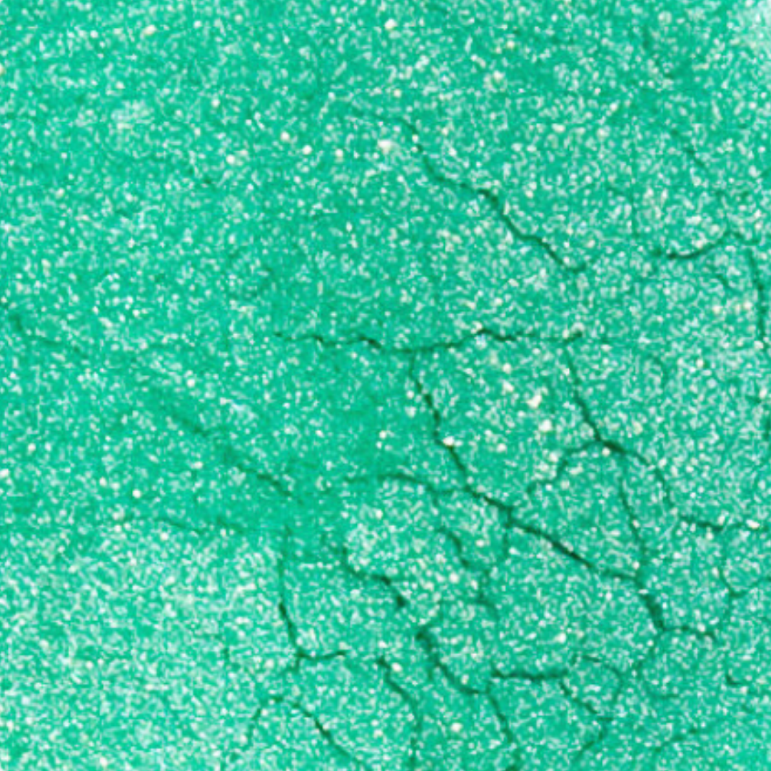Close-up of green textured paper with glitter