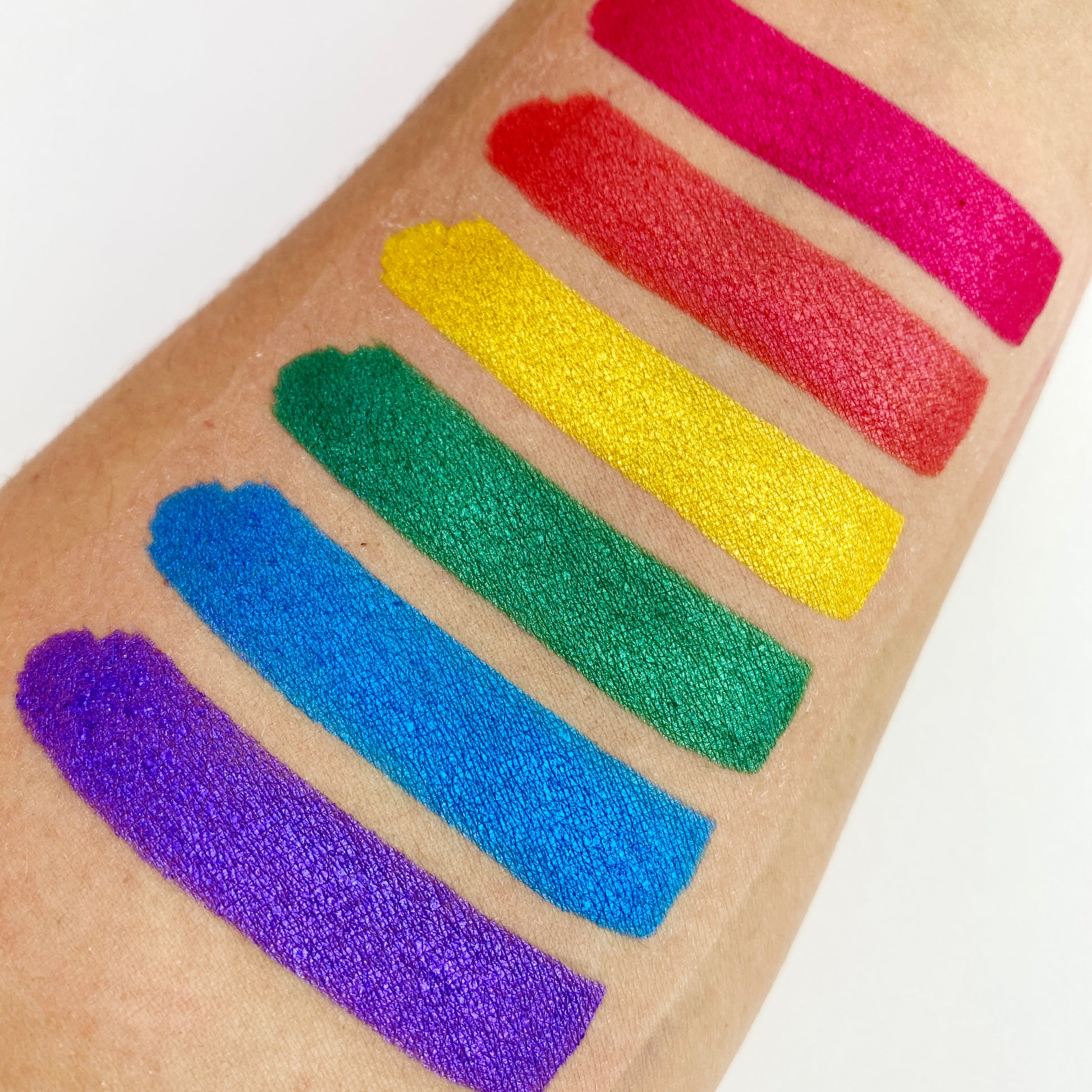 Arm swatches of the electro eye dust stack palette