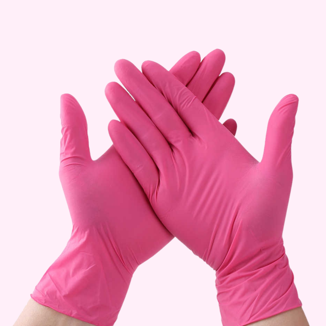 A Pair of Pink Vinyl Disposable Gloves Size Medium